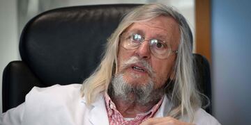 (FILES) In this file photo taken on February 26, 2020 French professor Didier Raoult, biologist and professor of microbiology, specialized in infectious diseases and director of IHU Mediterranee Infection Institute poses in his office in Marseille, southeastern France\u002E - Many people rushed on March 23, 2020 in front of the Marseille's center of expertise on infectious diseases, in order to be tested by the teams of Professor Didier Raoult who recommends treatment with chloroquine\u002E Regarding the treatment in question with chloroquine, according to the French Minister of Health, French High Public Health Council said on March 23, 2020, that the chloroquine could be given to patients suffering from \