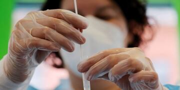 A chemist performs a rapid Covid-19 antigenic test at a pharmacy in Roubaix as a second wave of the coronavirus disease sweeps France, October 28, 2020\u002E REUTERS/Pascal Rossignol