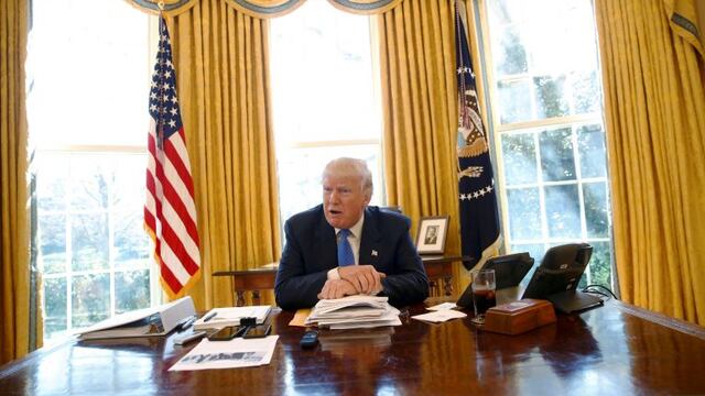 U.S. President Donald Trump gives an interview from his desk in the Oval Office at the White House in Washington, U.S., February 23, 2017. REUTERS/Jonathan Ernst     TPX IMAGES OF THE DAY