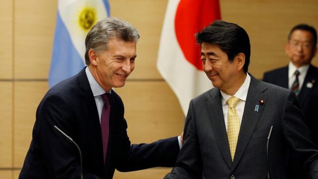 Argentinian President Mauricio Macri, left, shakes hands with Japan's Prime Minister Shinzo Abe during their joint press conference at Abe's official residence in Tokyo Friday, May 19, 2017. (Toru Hanai/Pool Photo via AP)