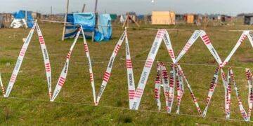Tomas en Guernica: una detenida por vender terrenos en redes sociales (Foto: Clarín)