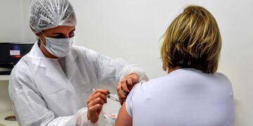 (FILES) In this file photo taken on July 24, 2020 Brazilian pediatric doctor Monica Levi, one of the volunteers who received the COVID-19 vaccine, works at the Specialized Clinic in Infectious and Parasitic Diseases and Immunizations (CEDIPI), in Sao Paulo, Brazil\u002E - The clinical trial for the Covid-19 vaccine being developed by AstraZeneca and Britain's University of Oxford has resumed in the United States, the drugmaker said October 23\u002E\n\
