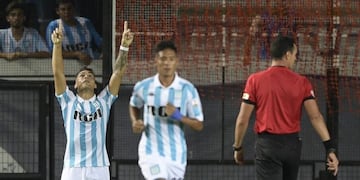 Argentina's Racing Club forward Lautaro Martinez (L) celebrates after scoring a goal against Brazil's Cruzeiro during their Copa Libertadores 2018, Group E first leg football match at Juan Domingo Peron stadium in Buenos Aires, Argentina, on February 27, 2018\u002E / AFP PHOTO / JUAN MABROMATA