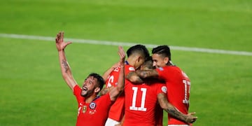 Chile's Mauricio Isla, left, celebrates after Chile's Eduardo Vargas scored his side's 4th goal during a Copa America Group C soccer match against Japan at the Morumbi stadium in Sao Paulo, Brazil, Monday, June 17, 2019\u002E (AP Photo/Nelson Antoine)