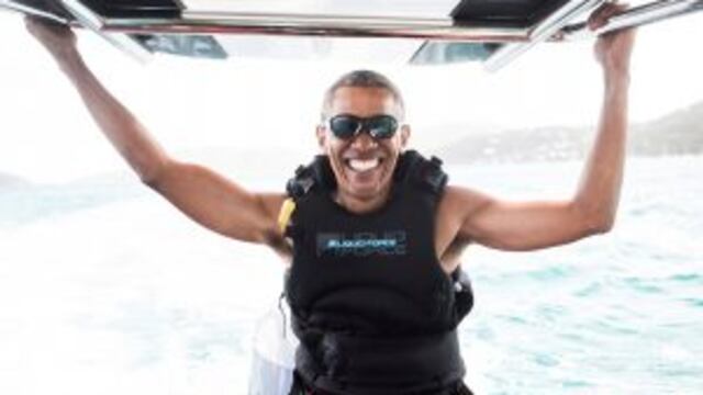 In this recent but undated photo made available by Virgin.com, former U.S President Barack Obama prepares to kitesurf during his stay on Moskito Island, British Virgin Islands. The former president and his wife stayed on Mosikto Island owned by Richard Br