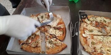 Colocó marihuana en una pizza y se la llevó a su hijo detenido\u002E (MPF)