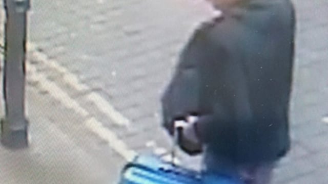 This is a handout photo taken on Monday, May 22, 2017 from CCTV and issued on Monday, May 29, 2017 by Greater Manchester Police of Salman Abedi in an unknown location of the city centre in Manchester, England. The police released an image of the bomber carrying a distinctive blue suitcase and an image of a replica of the case as they appealed for information about his final days. (Greater Manchester Police via AP)