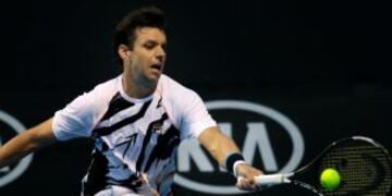 Argentina's Horacio Zeballos makes a forehand return to Croatia's Ivo Karlovic during their first round match at the Australian Open tennis championships in Melbourne, Australia, Tuesday, Jan. 17, 2017. (AP Photo/Aaron Favila)