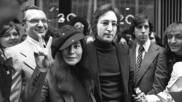 FILE - In this April 18, 1972, file photo, John Lennon and his wife, Yoko Ono, leave a U.S. Immigration hearing in New York City. The argument over President Barack Obamau2019s legal authority to defer deportations begins 42 years ago with a bit of hashish, a