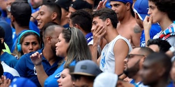 Fans of Cruzeiro react during the Brazilian Championship football match against Palmeiras, in Belo Horizonte, Brazil, on December 8, 2019\u002E - Cruzeiro, one of the great clubs in Brazil, reached the last day of the Brasileirao in the relegation zone and does not depend on itself to remain in the elite of Brazilian football\u002E (Photo by DOUGLAS MAGNO / AFP)