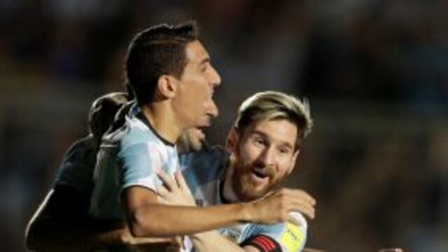 Argentina's Angel Di Maria, left, celebrates with teammate Lionel Messi, right, after Lucas Pratto, back, scored against Colombia during a 2018 World Cup qualifying soccer match in San Juan, Argentina, Tuesday, Nov. 15, 2016. Argentina won the match 3-0.
