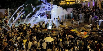 Police fire tear gas into a crowd in Wong Tai Sin district in Hong Kong on Saturday, Aug\u002E 3, 2019\u002E Protesters and authorities clashed in Hong Kong again on Saturday, as demonstrators removed a Chinese national flag from its pole and flung it into the city's iconic Victoria Harbour and police fired tear gas after some protesters vandalized a police station\u002E (AP Photo/Kin Cheung)