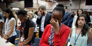 A handout photo by UNEP shows the UN Staff observing a minute of silence for the victims of the accident of the Ethiopian Airlines, including 19 UN workers, before the opening plenary of the 4th UN Environment Assembly at the UN headquaters in Nairobi, Kenya, on March 11, 2019\u002E (Photo by UNEP/C\u002E Villemain / UNEP / AFP)