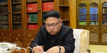 This picture from North Korea's official Korean Central News Agency (KCNA) taken on July 3, 2017 and released on July 4, 2017 shows North Korean leader Kim Jong-Un signing the order to carry out the test-fire of the intercontinental ballistic missile Hwasong-14 at an undisclosed location\u002E\r\nNorth Korea declared on July 4 it had successfully tested its first intercontinental ballistic missile -- a watershed moment in its push to develop a nuclear weapon capable of hitting the mainland United States\u002E / AFP PHOTO / KCNA VIA KNS / STR / South Korea OUT / REPUBLIC OF KOREA OUT   ---EDITORS NOTE--- RESTRICTED TO EDITORIAL USE - MANDATORY CREDIT \
