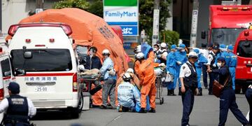 Rescuers work at the scene of an attack in Kawasaki, near Tokyo Tuesday, May 28, 2019\u002E A man wielding a knife attacked commuters waiting at a bus stop just outside Tokyo during Tuesday morning's rush hour, Japanese authorities and media said\u002E (Kyodo News via AP)