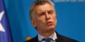 Argentina's President Mauricio Macri speaks during a joint press conference with Chile's Michelle Bachelet (out of frame) in Olivos, Buenos Aires province, on December 16, 2016. / AFP PHOTO / Emiliano Lasalvia