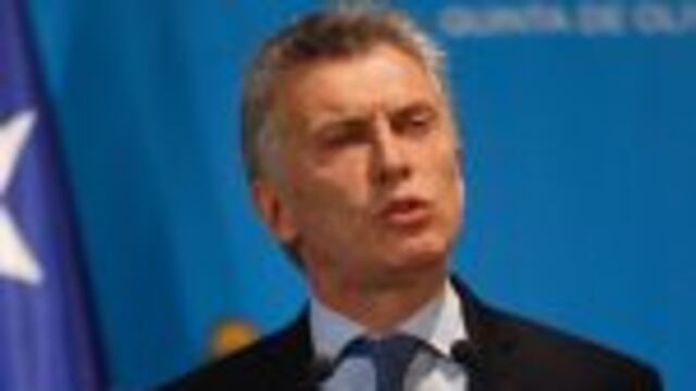 Argentina's President Mauricio Macri speaks during a joint press conference with Chile's Michelle Bachelet (out of frame) in Olivos, Buenos Aires province, on December 16, 2016. / AFP PHOTO / Emiliano Lasalvia