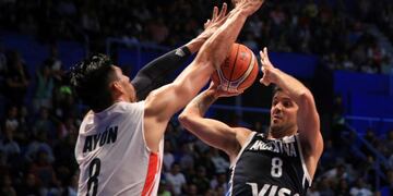 Gustavo Ayon from Mexico, left, blocks Nicolas Laprovittola from Argentina in the fourth quarter of their FIBA basketball World Cup Qualifiers game in Mexico City, Friday, Sep\u002E 14, 2018\u002E (AP Photo/Christian Palma)
