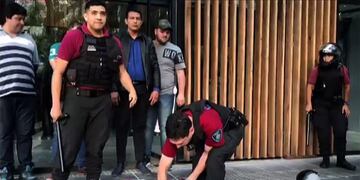 Video grab showing security forces arresting a supporter of River Plate during clashes in the surroundings of the Monumental stadium in Buenos Aires following an attack on the Boca team bus before the all-Argentine Copa Libertadores second leg final match between River Plate and Boca Juniors on November 24, 2018\u002E - Saturday's \