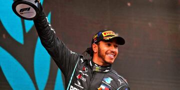 15 November 2020, Turkey, Istanbul: British Formula One driver of Mercedes AMG Petronas team, Lewis Hamilton, celebrates on the podium after winning the Turkish Grand Prix and securing his seventh world championship at Istanbul Park circuit\u002E Photo: -/PA Wire/dpa
