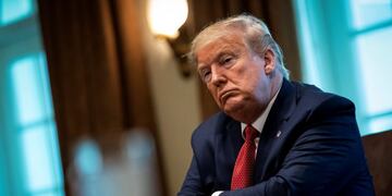 U\u002ES\u002E President Donald Trump listens during a meeting with supply chain distributors in the Cabinet Room of the White House in Washington, U\u002ES\u002E, March 29, 2020\u002E REUTERS/Al Drago