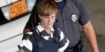 FILE - In this June 18, 2015 file photo, Charleston, S.C., shooting suspect Dylann Roof is escorted from the Cleveland County Courthouse in Shelby, N.C. A federal jury has sentenced Roof to death for killing nine black church members in a racially motivat
