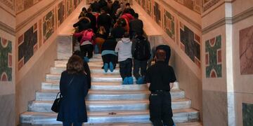 Faithfuls kneel on the new restored Holy Stair (Scala Santa) at San Giovanni in Laterano in Rome during a special opening on April 12, 2019\u002E (Photo by Tiziana FABI / AFP)