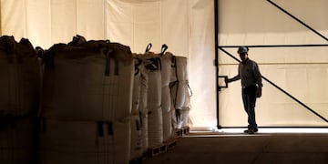 A worker closes a warehouse of lithium carbonate processed from the Rockwood Lithium mine on the Atacama salt flat, the largest lithium deposit currently in production, in Antofagasta, northern Chile January 14, 2013\u002E Far from the soy and cattle that dominate its vast fertile pampas, Argentina harbors another valuable commodity that is rocketing in price and demand and luring newly welcomed foreign investors\u002E Lithium, the so-called \