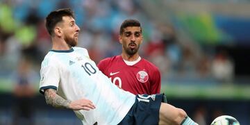 Argentina's Lionel Messi controls the ball as Qatar's Hassan Al Haydos looks on during a Copa America Group B soccer match at the Arena do Gremio in Porto Alegre, Brazil, Sunday, June 23, 2019\u002E (AP Photo/Edison Vara)