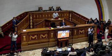 Lawmakers hold an emergency session at Congress in Caracas, Venezuela, Tuesday, Oct. 25, 2016. After the government suspended a recall referendum seeking the president's removal last week, the opposition-controlled congress began debating Venezuelan President Nicolas Maduro's