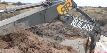 Retroexcavadora hundida