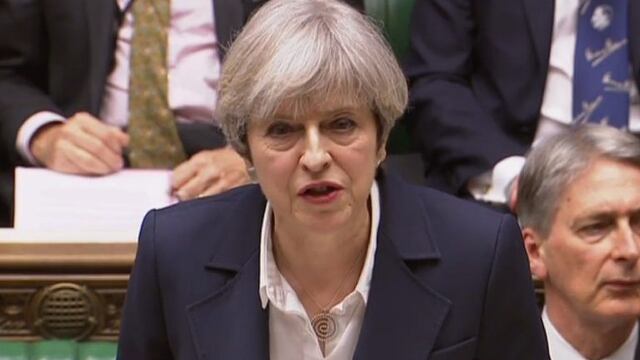 A still image taken from footage broadcast by the UK Parliamentary Recording Unit (PRU) on March 29, 2017 shows British Prime Minister Theresa May at the dispatch box making a statement in the House of Commons in London after the letter invoking the provi