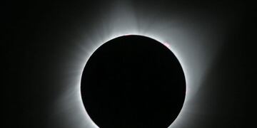 JACKSON, WY - AUGUST 21: The sun is is in full eclipse over Grand Teton National Park on August 21, 2017 outside Jackson, Wyoming\u002E Thousands of people have flocked to the Jackson and Teton National Park area for the 2017 solar eclipse which will be one of the areas that will experience a 100% eclipse on Monday August 21, 2017\u002E George Frey/Getty Images/AFP\n== FOR NEWSPAPERS, INTERNET, TELCOS & TELEVISION USE ONLY ==