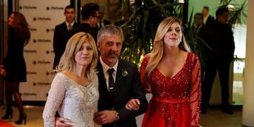 Lionel Messi's family members, from left to right, mother Celia Maria Cuccittini, father Jorge Messi, and sister Maria Sol, pose on the red carpet after the soccer superstar wed his childhood sweetheart Antonella Roccuzzo, in Rosario, Argentina, Friday, June 30, 2017\u002E About 250 guests, including teammates and former teammates of the Barcelona soccer star, attended the highly anticipated ceremony\u002E (AP Photo/Victor R\u002E Caivano)