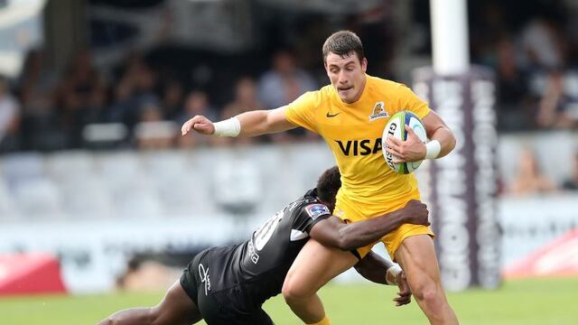 Sharks' Inny Radebe (L) tackles Jaguares' Gonzalo Bertranou during the Super XV rugby union match between Sharks and Jaguares at Kingspark Rugby Stadium on April 8, 2017, in Durban.n / AFP PHOTO / ANESH DEBIKY