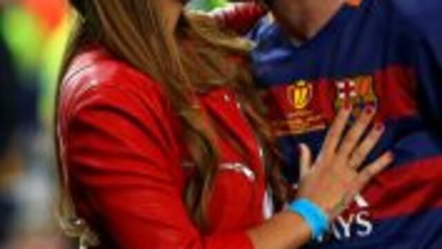 Barcelona's Lionel Messi kisses his wife Antonella Roccuzzo as they celebrate after winning the final of the Copa del Rey soccer match between FC Barcelona and Sevilla FC at the Vicente Calderon stadium in Madrid, Sunday, May 22, 2016. Barcelona won 2-0 (