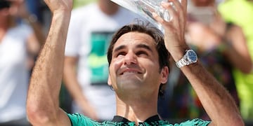 Roger Federer, of Switzerland, holds up his trophy after defeating Rafael Nadal, of Spain, during the men's singles final tennis match at the Miami Open, Sunday, April 2, 2017, in Key Biscayne, Fla. (AP Photo/Wilfredo Lee)