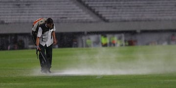 Soccer Football - Copa Libertadores - Group D - River Plate v Binacional - Monumental Stadium, Buenos Aires, Argentina - March 11, 2020 A groundsman work to dry the pitch as rain falls before the match REUTERS/Agustin Marcarian