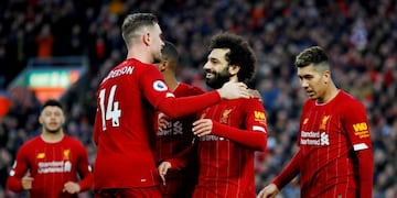 FILE PHOTO: Soccer Football - Premier League - Liverpool v Southampton - Anfield, Liverpool, Britain - February 1, 2020 Liverpool's Mohamed Salah celebrates scoring their third goal with Jordan Henderson and teammates REUTERS/Phil Noble EDITORIAL USE ONLY\u002E No use with unauthorized audio, video, data, fixture lists, club/league logos or \
