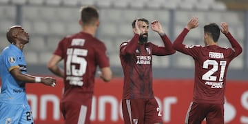 Lucas Pratto of Argentina's River Plate, center, celebrates scoring his side's 6th goal with teammte Cristian Ferreira during a Copa Libertadores soccer match against Peru's Binacional in Lima, Peru, Tuesday, Sept\u002E 22, 2020\u002E(Paolo Aguilar/Pool via AP)
