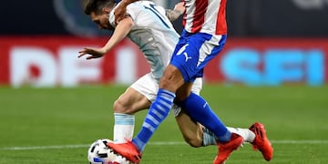 Paraguay's Junior Alonso, right, and Argentina's Lionel Messi battle for the ball during a qualifying soccer match for the FIFA World Cup Qatar 2022 in Buenos Aires, Argentina, Thursday, Nov\u002E 12, 2020\u002E(Marcelo Endelli, Pool via AP)