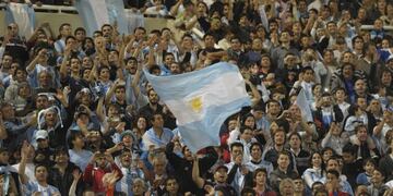 Argentine fans cheer for their team during a Brazil 2014 World Cup South American qualifier match against Paraguay at Mario Kempes stadium in Cordoba some 600 Km north-west of Buenos Aires, on September 7, 2012\u002E AFP PHOTO / Juan Mabromata\r\n cordoba futbol eliminatorias mundial 2014 brasil futbol hinchada futblistas seleccion paraguay vs\u002E argentina