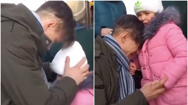 Ucrania. Un padre se despide de su hija que va a ser evacuada.