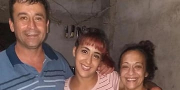 El femicida, una de las cuatro hijas y la víctima.