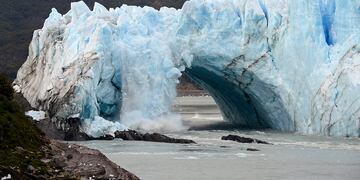 The Perito Moreno Glacier's ice bridge collapses into Lake Argentina, at Los Glaciares National Park, near El Calafate, in Argentina's Patagonia region, Thursday, March 10, 2016. The massive natural monument in the province of Santa Cruz periodically advances over the lake, and then breaks off. The glacier last ruptured in March 2012. (AP Photo/Francisco Munoz)