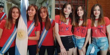 Valentina, Josefina y Milagros recibieron la bandera de Argentina.