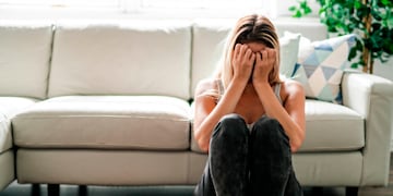 A Unhappy lonely depressed woman at home living room