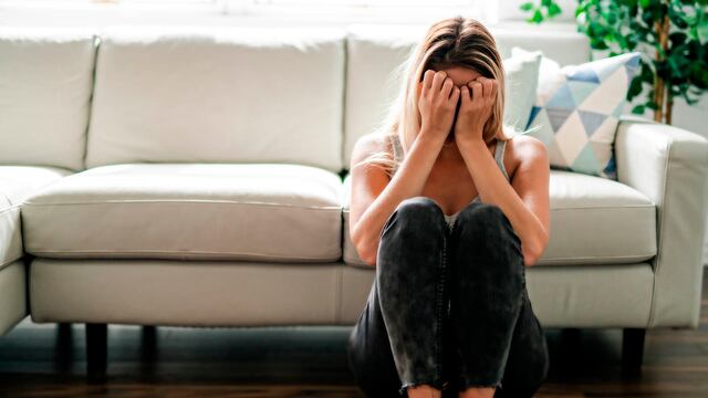 A Unhappy lonely depressed woman at home living room